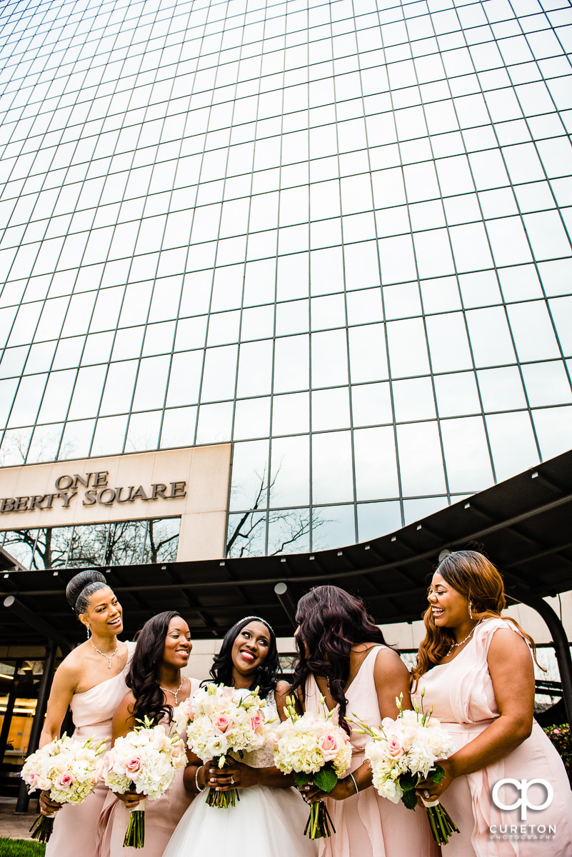 Bride and her Bridesmaids outside in front of the Commerce Club in downtown Greenville before the wedding ceremony.