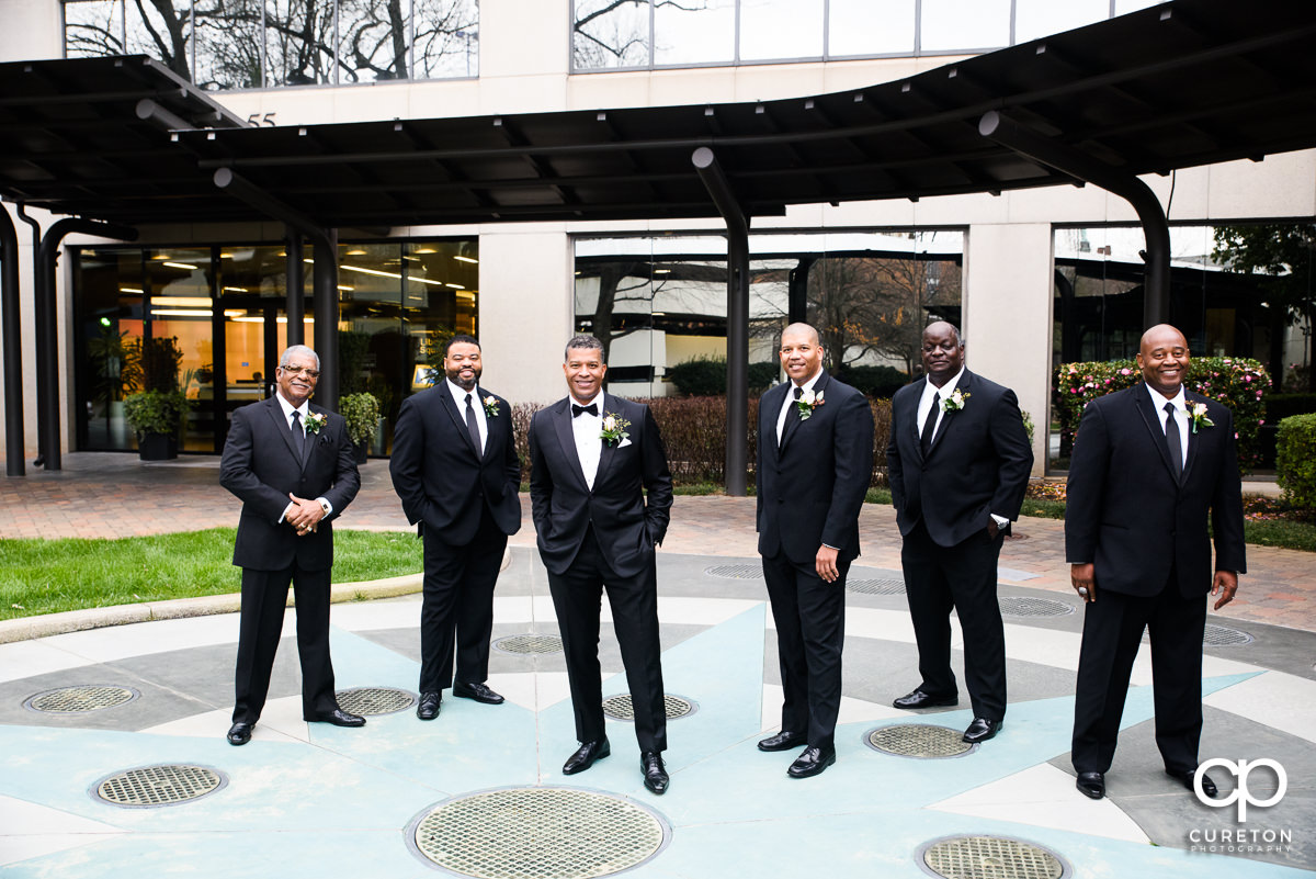 Groomsmen in front of the Commerce Club.
