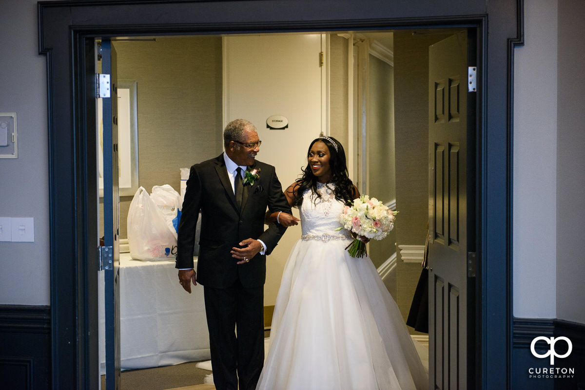 Bride and her father making a grand entrance.