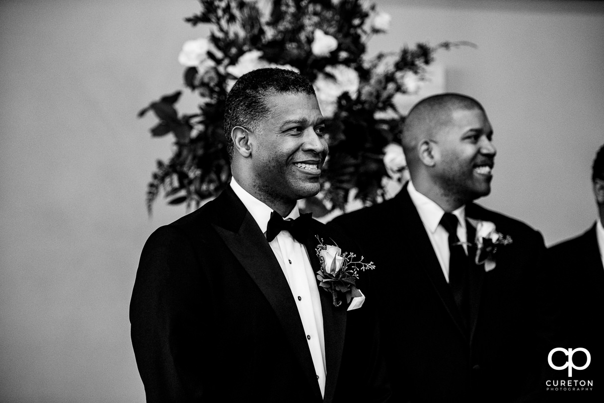 Groom sees his bride walking down the aisle for the first time at The Commerce Club wedding.