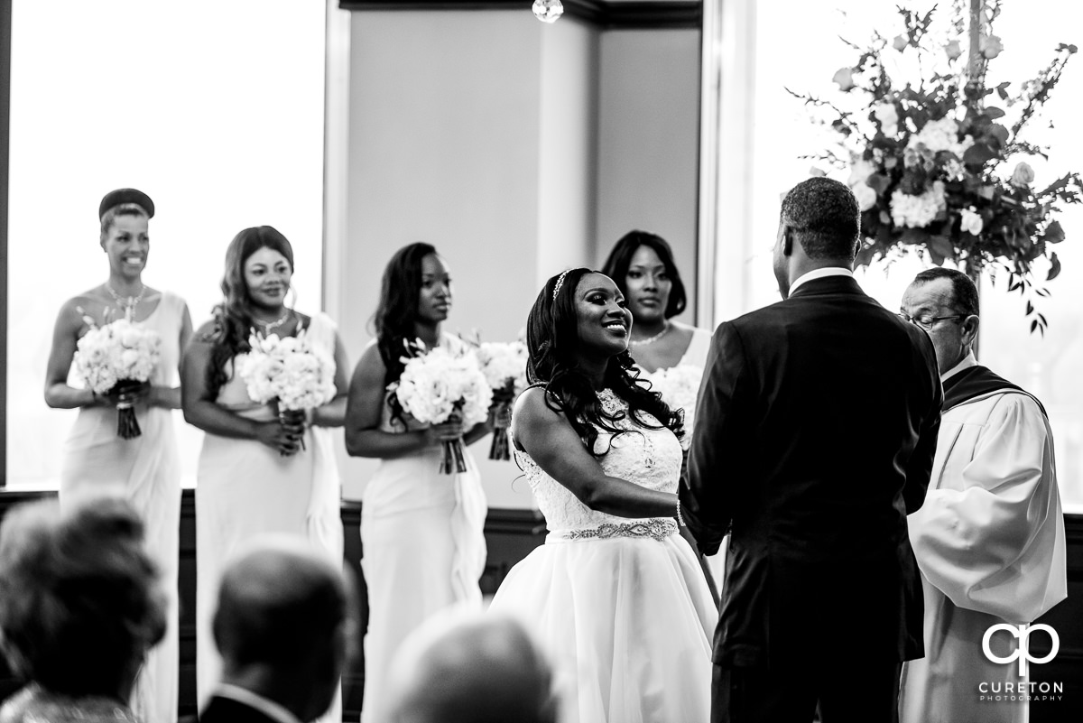 Bride smiling during the ceremony.