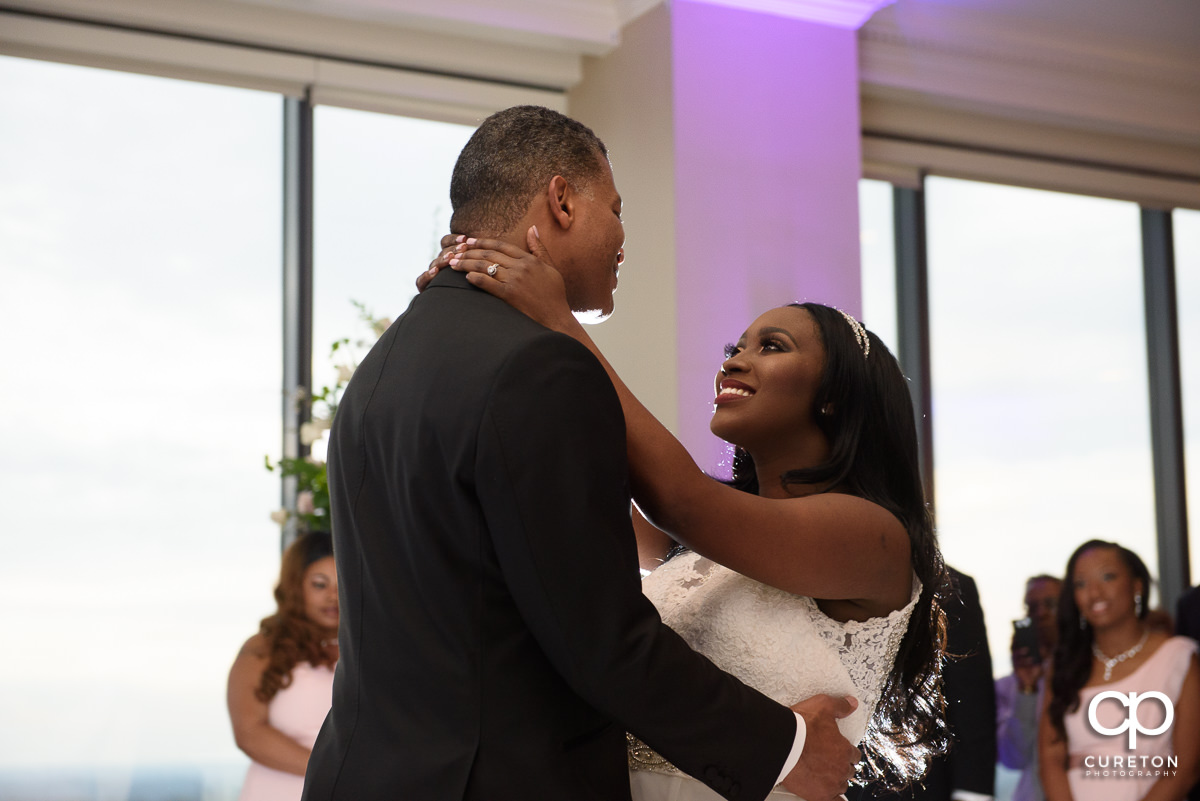 Bride looking up at her groom during their first dance.