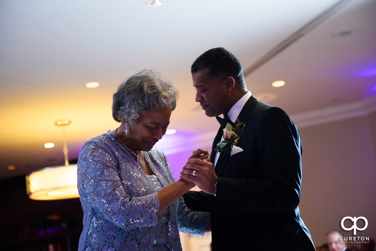 Groom dancing with his mother at the wedding reception.