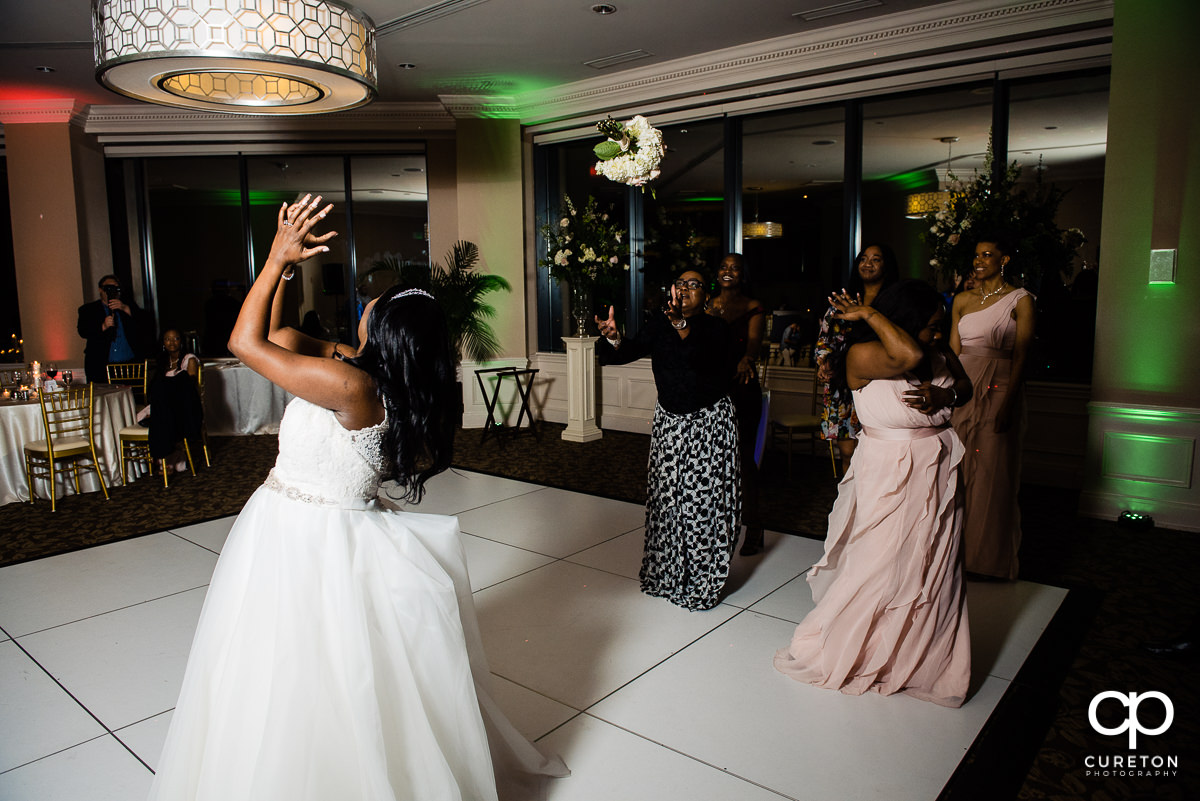 Bride tossing her bouquet.