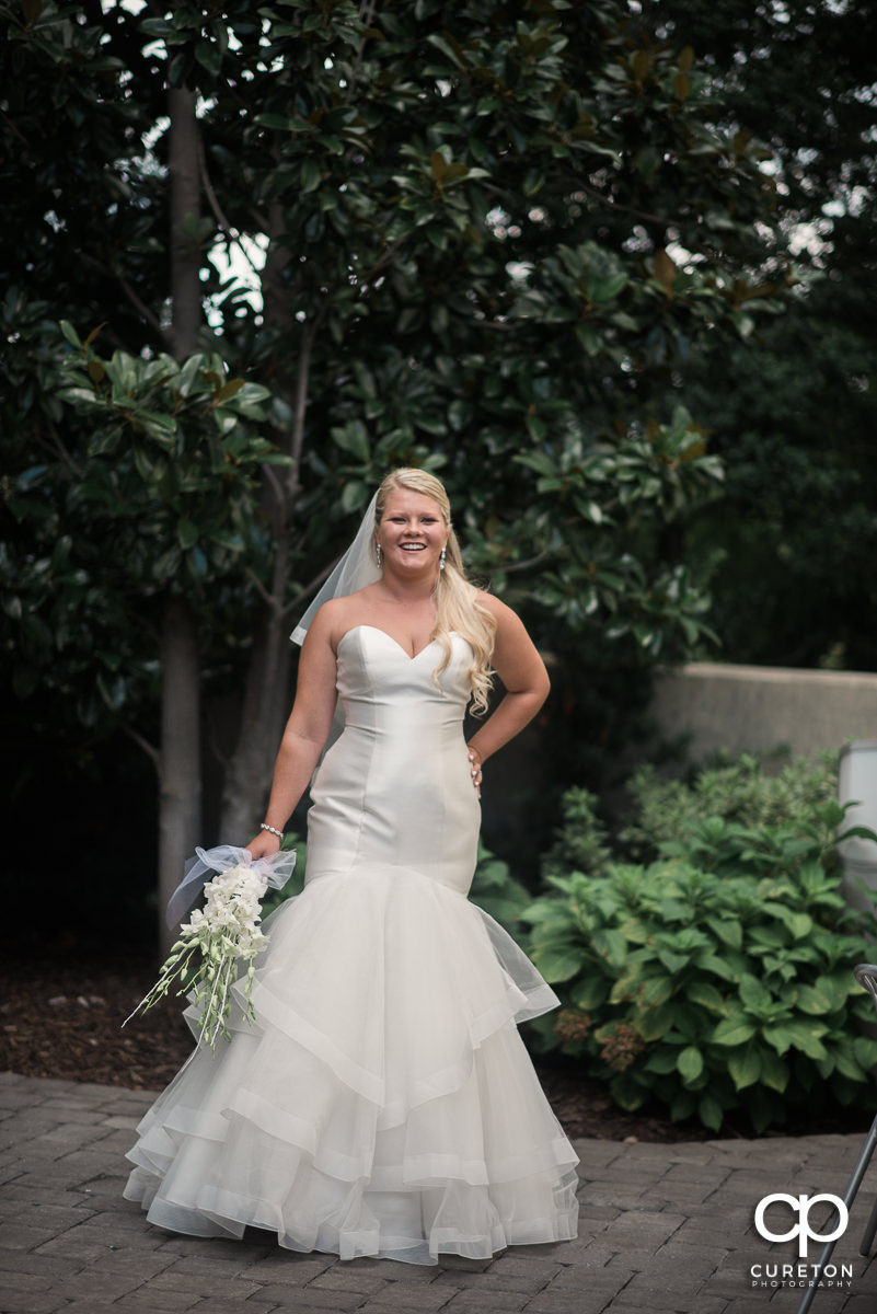 Bride smiling outside the Commerce Club.