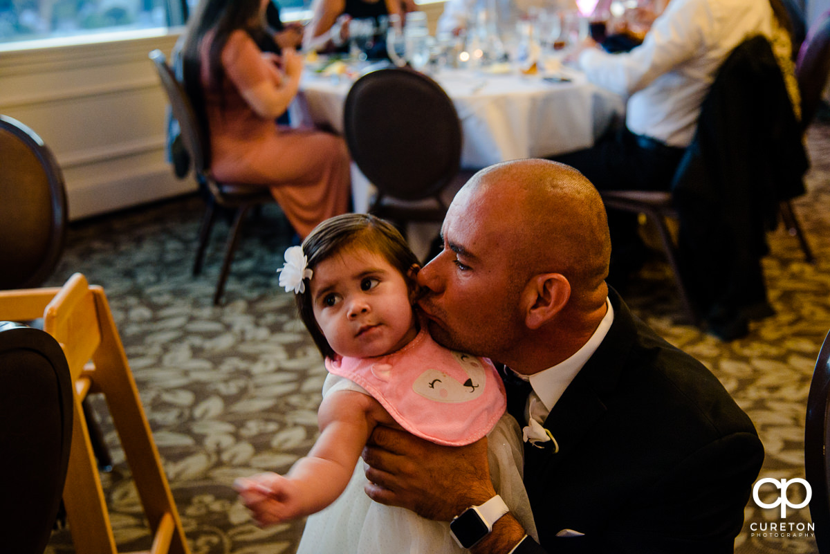 Groomsmen and his daughter at the reception.