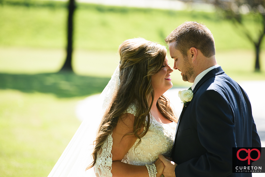 Bride and groom looking at each other during their first look.