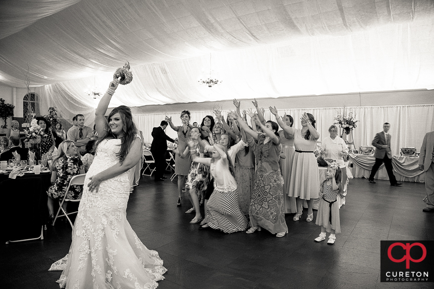 Bride tossing the bouquet 
