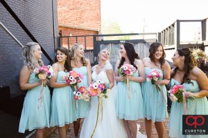 Creative pose for bride and bridesmaids.