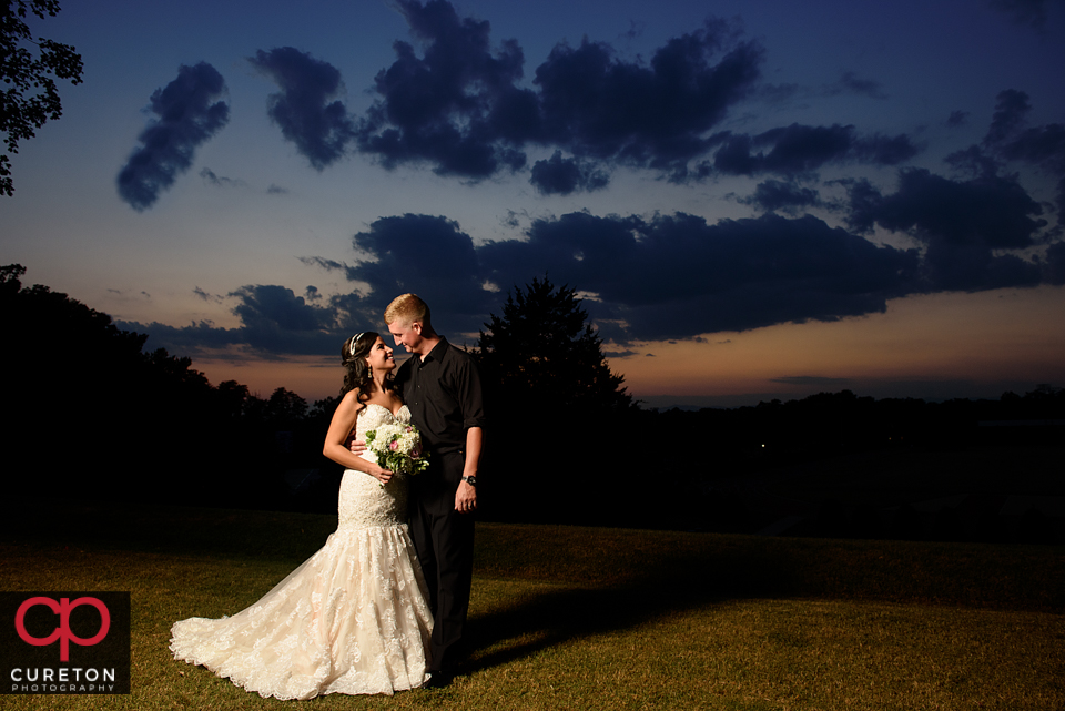 Bride and groom at sunset after their Daniel Chapel wedding.