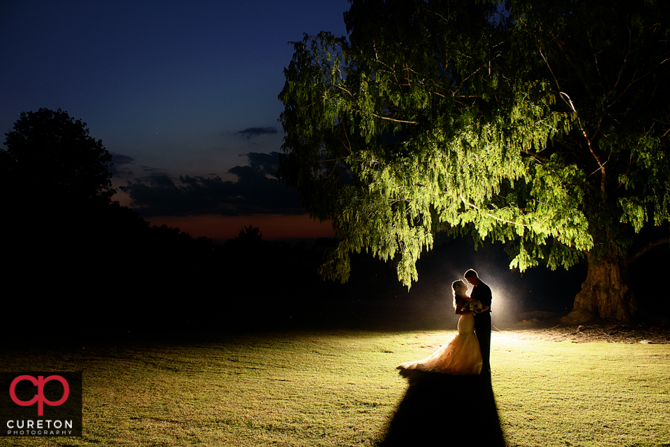 Newly married couple at sunset after their Daniel chapel wedding.