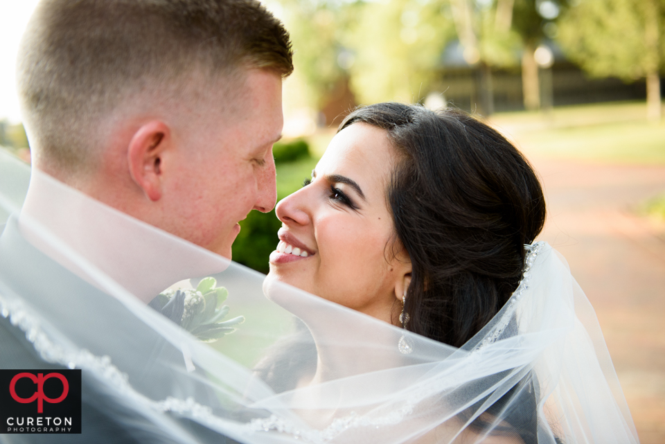 Bride and groom outside of their Daniel chapel wedding at Furman.