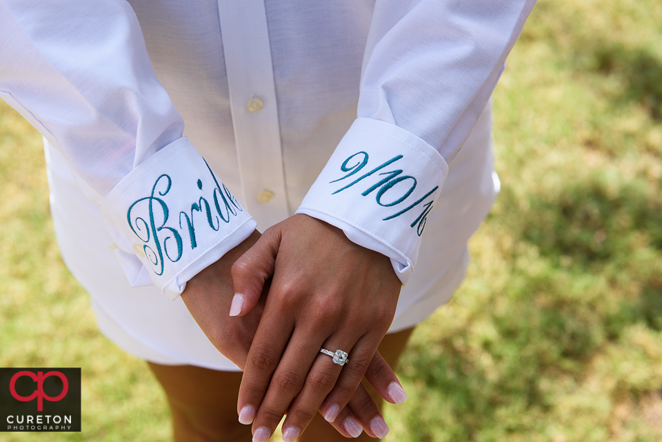 The bride wearing her embroidered shirt before the wedding.