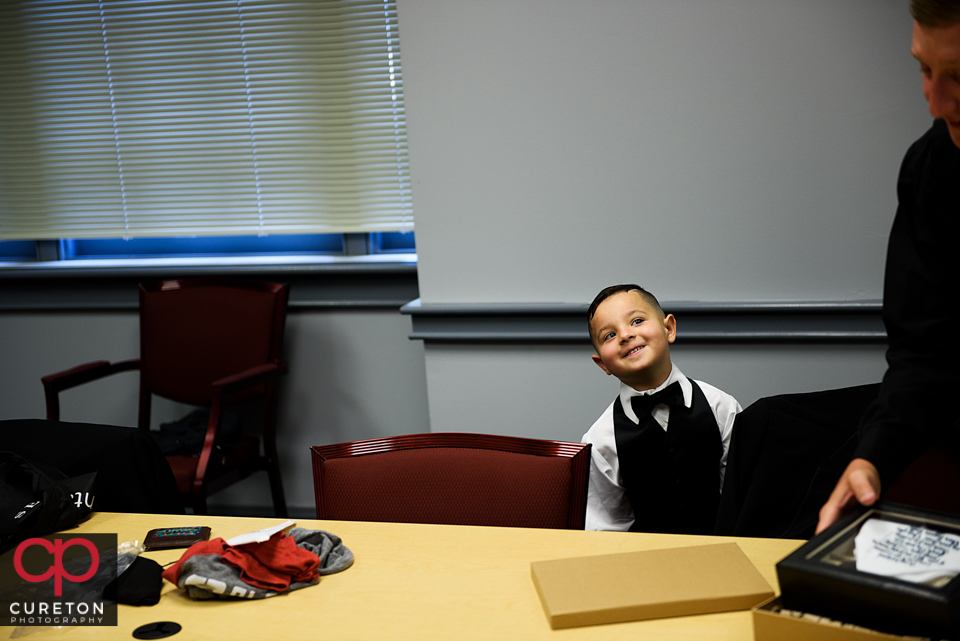 The ringbearer staring at the groom.