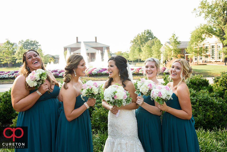 Bridesmaids in front of the fountains at Furman.