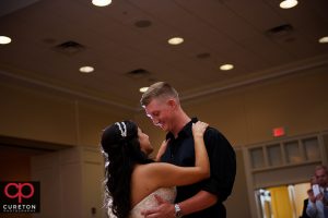 Bride and Groom sharing their first dance.