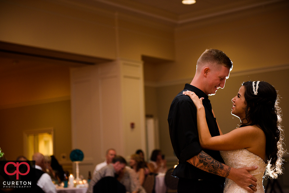 Bride and groom sharing a first dance.