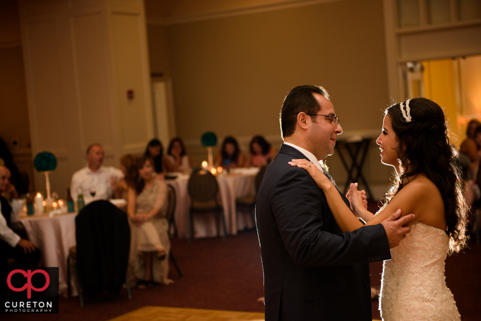 Father dancing with his daughter at the wedding reception.