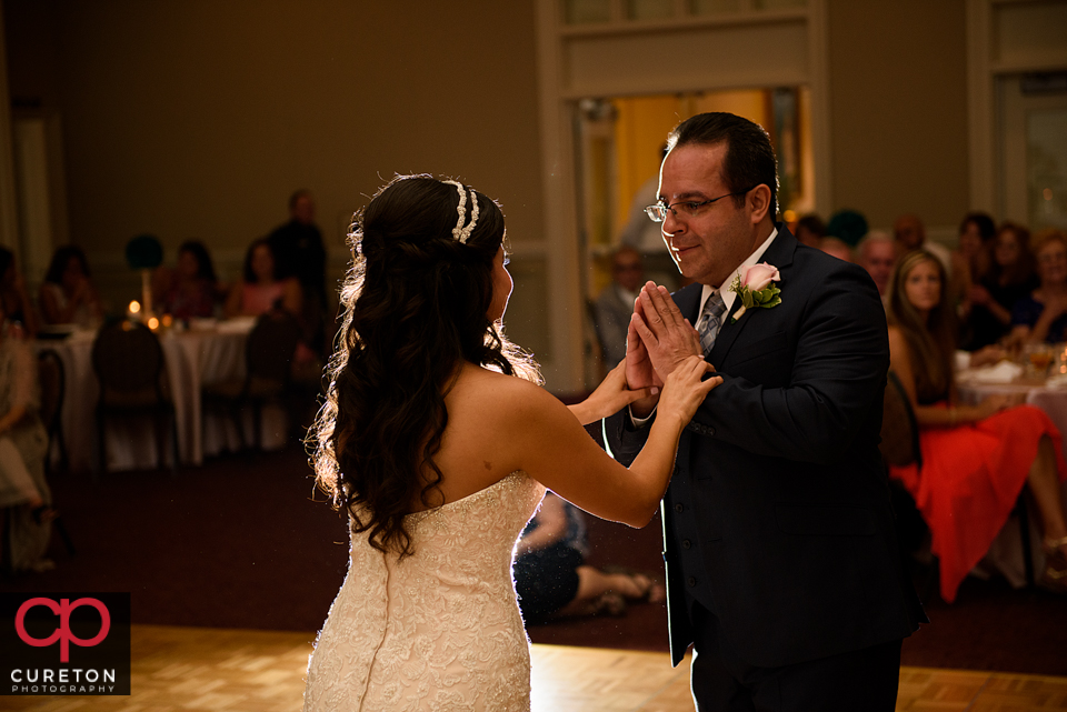 Father of the bride and the bride.