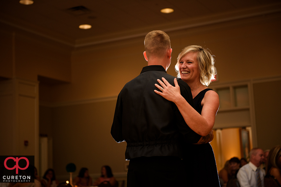 Groom dancing with his mother.