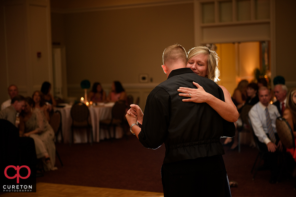 Groom and his mother dancing.