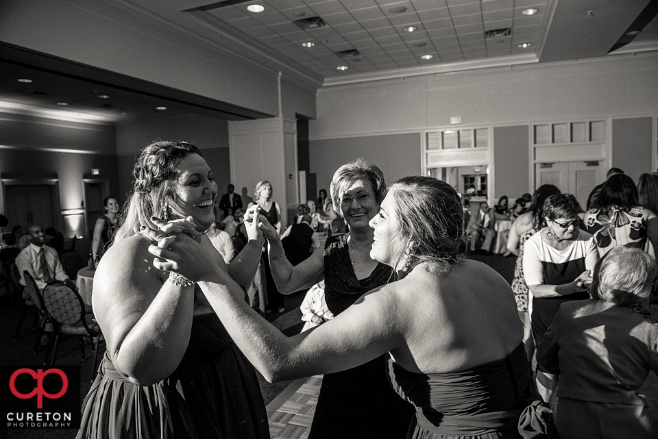 Bridesmaids dancing.