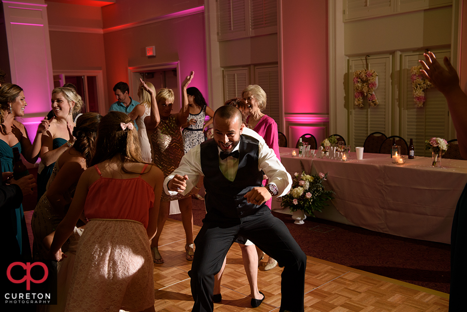 Wedding guest dancing to the sounds of Uptown Entertainment.