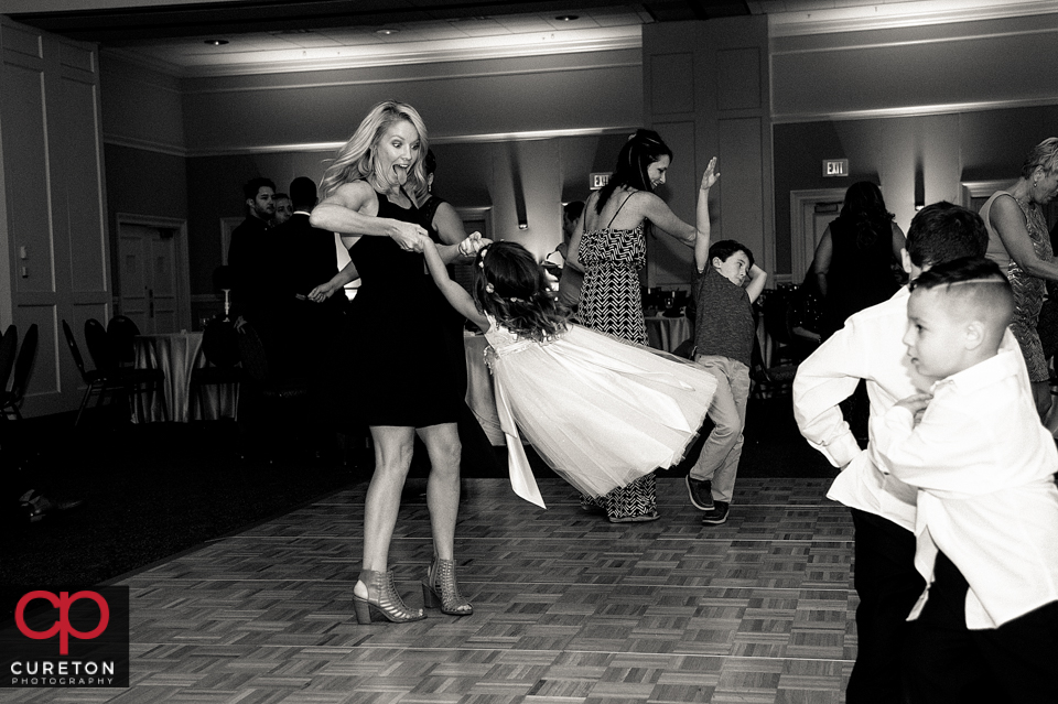 Wedding guest dancing to the sounds of Uptown Entertainment at the Younts Center wedding reception.