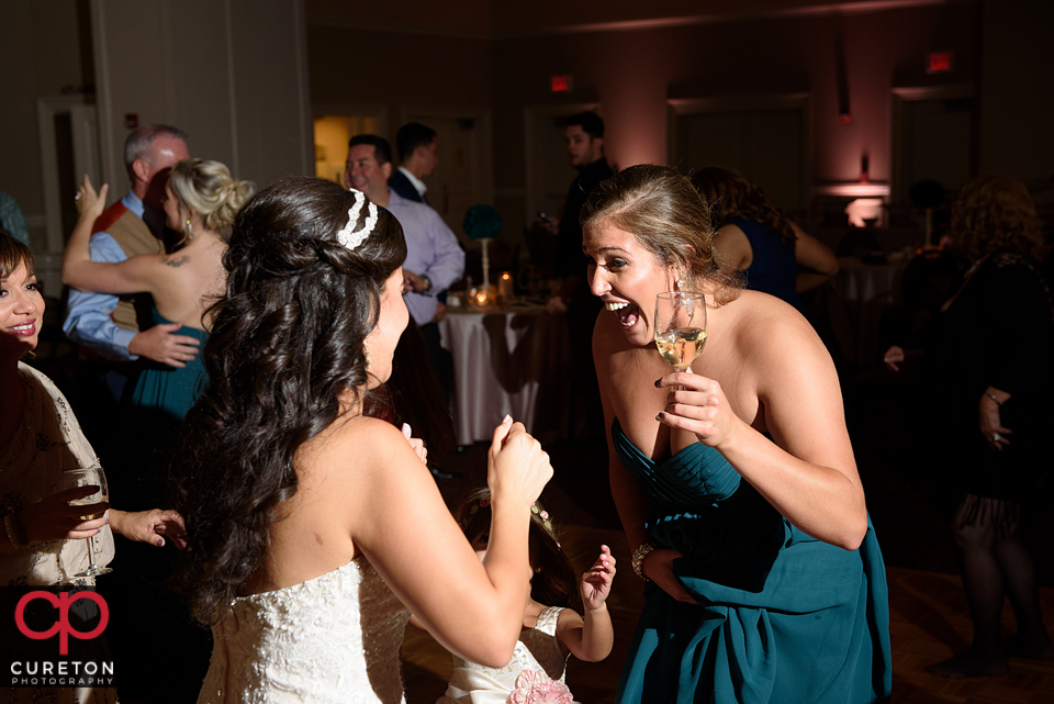 Wedding guest dancing to the sounds of Uptown Entertainment at the Younts Center wedding reception.