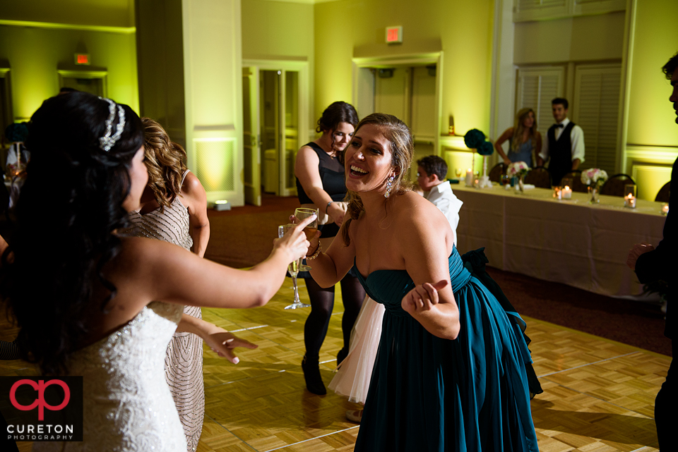 Wedding guest dancing to the sounds of Uptown Entertainment at the Younts Center wedding reception.