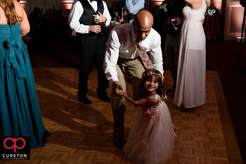 Wedding guest dancing to the sounds of Uptown Entertainment at the Younts Center wedding reception.