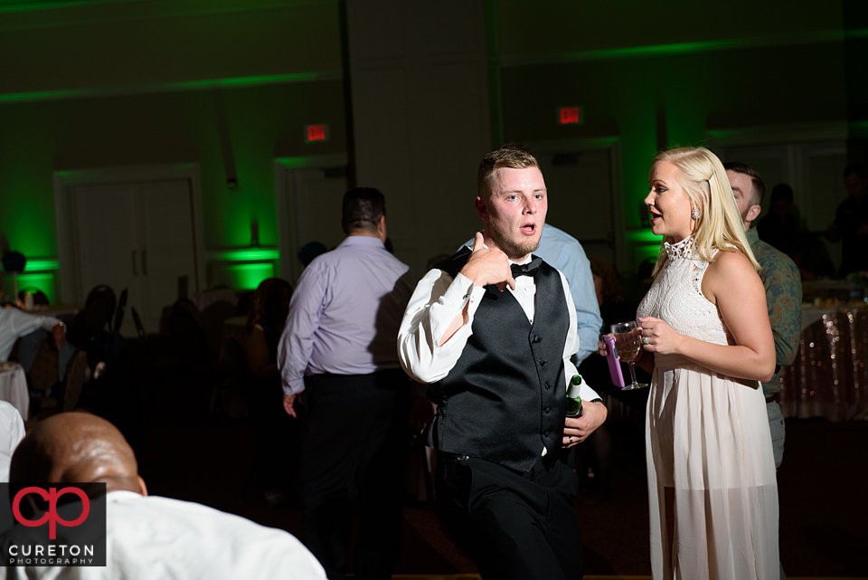 Wedding guest dancing to the sounds of Uptown Entertainment at the Younts Center wedding reception.