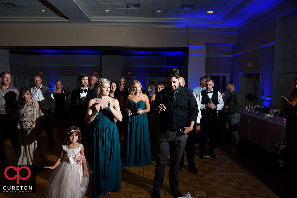 Wedding guest dancing to the sounds of Uptown Entertainment at the Younts Center wedding reception.