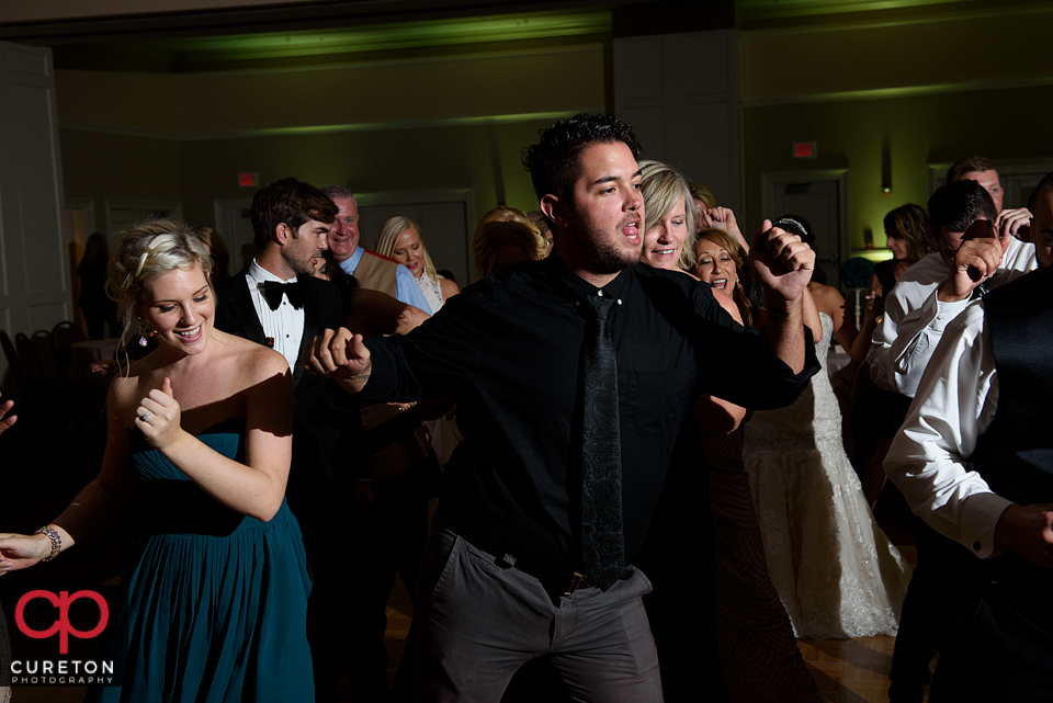 Wedding guest dancing to the sounds of Uptown Entertainment at the Younts Center wedding reception.