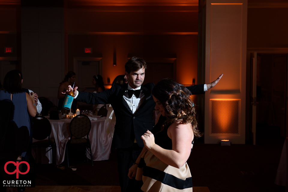 Wedding guest dancing to the sounds of Uptown Entertainment at the Younts Center wedding reception.