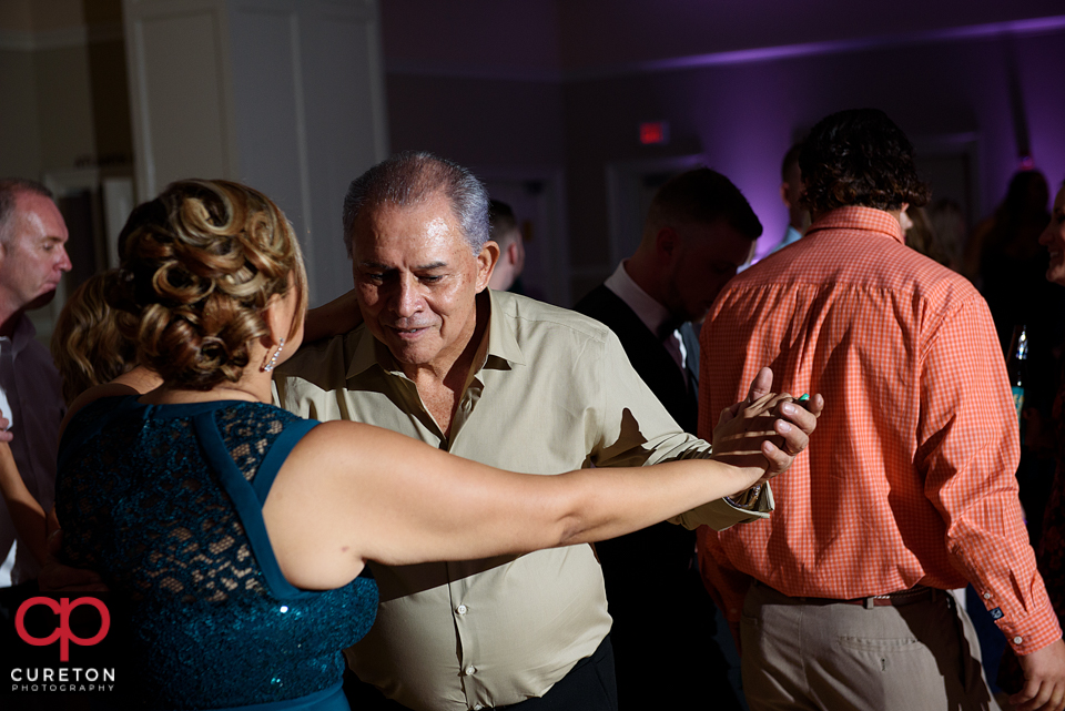 Wedding guest dancing to the sounds of Uptown Entertainment at the Younts Center wedding reception.