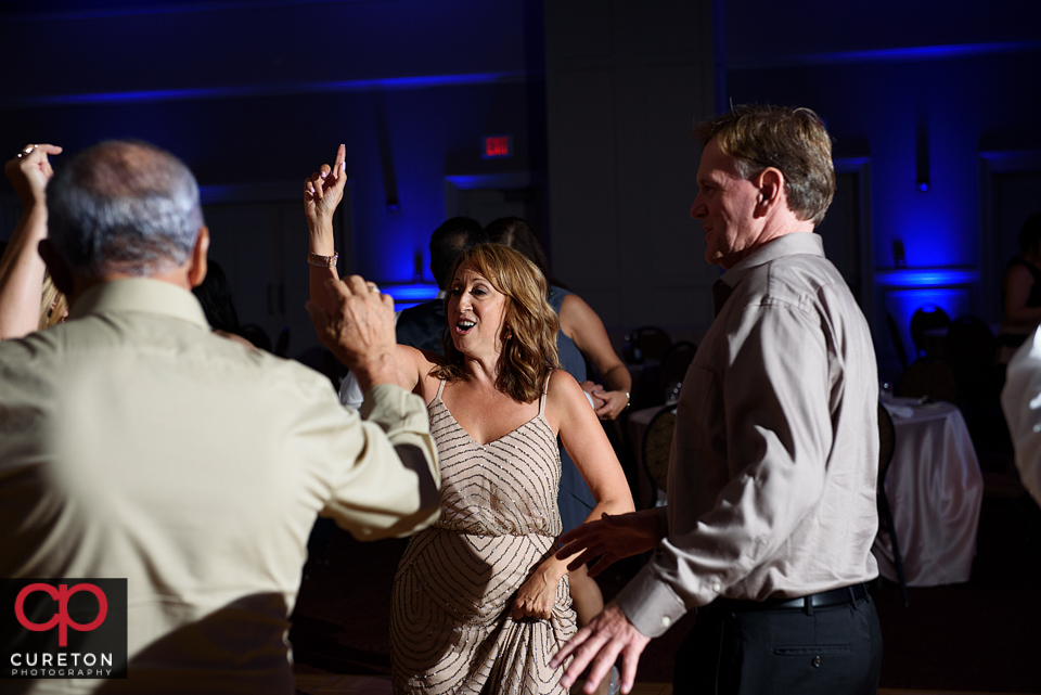 Wedding guest dancing to the sounds of Uptown Entertainment at the Younts Center wedding reception.