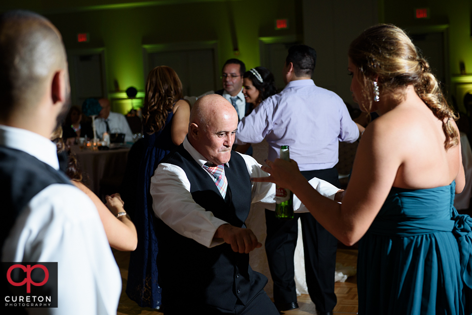 Wedding guest dancing to the sounds of Uptown Entertainment at the Younts Center wedding reception.
