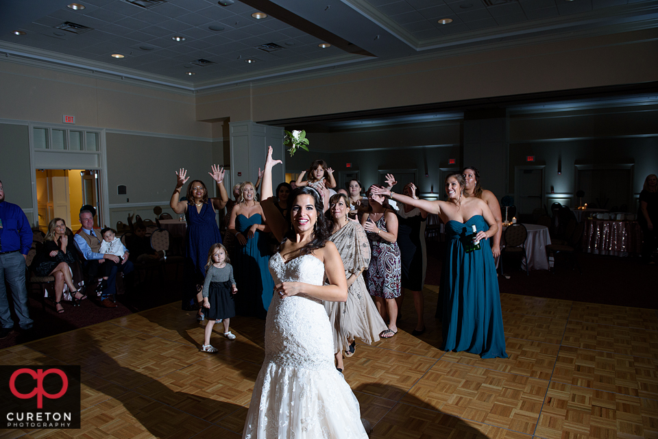 Bride tossing her bouquet.