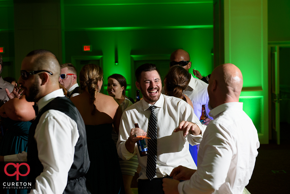 Wedding guest dancing to the sounds of Uptown Entertainment at the Younts Center wedding reception.