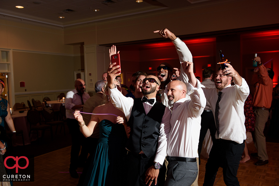 Wedding guest dancing to the sounds of Uptown Entertainment at the Younts Center wedding reception.