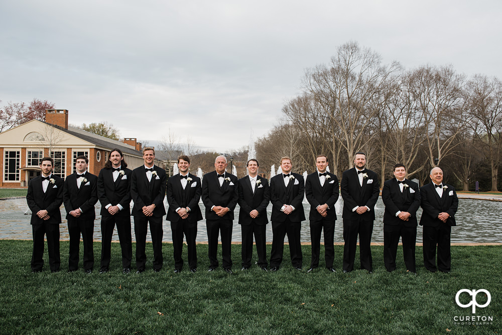 Groomsmen in front of the fountain at Furman University.