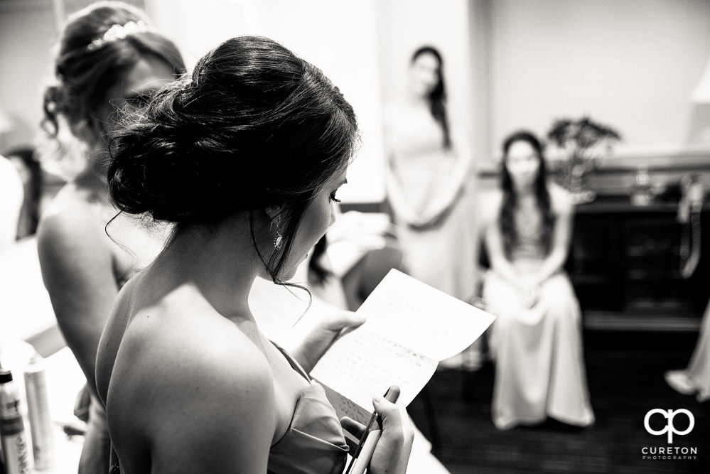 Bridesmaids reading a note.