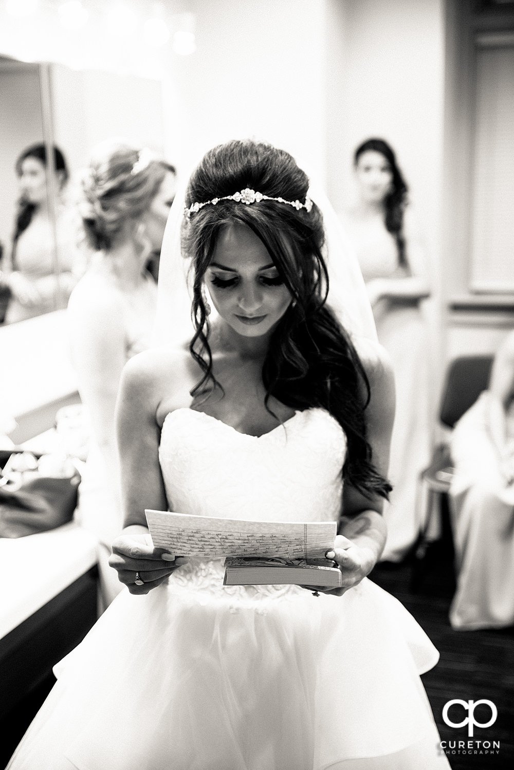 Bride reading a note from her groom.