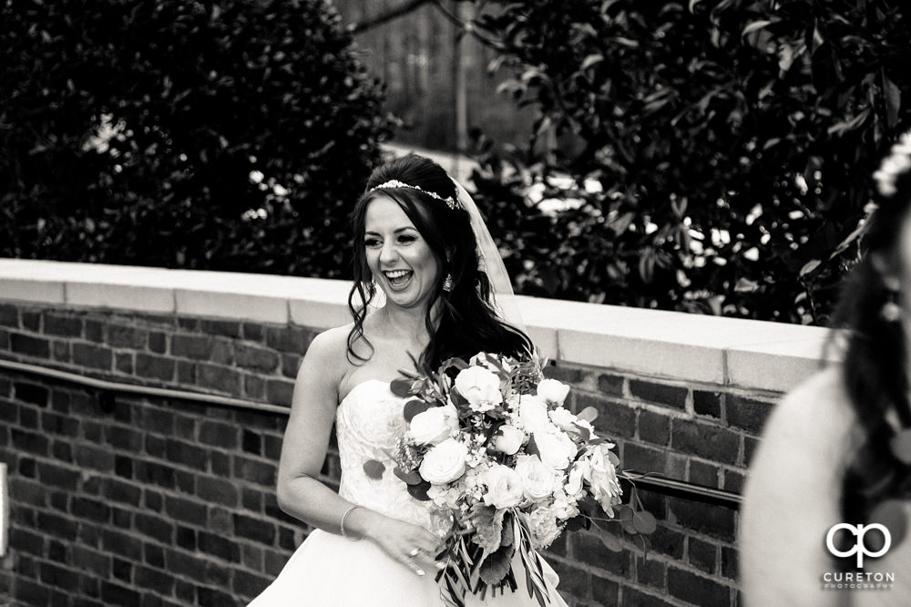 Bride laughing before the wedding.