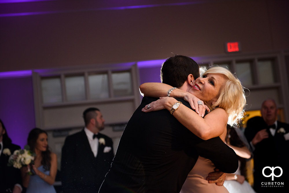 Groom dancing with his mother at the reception.