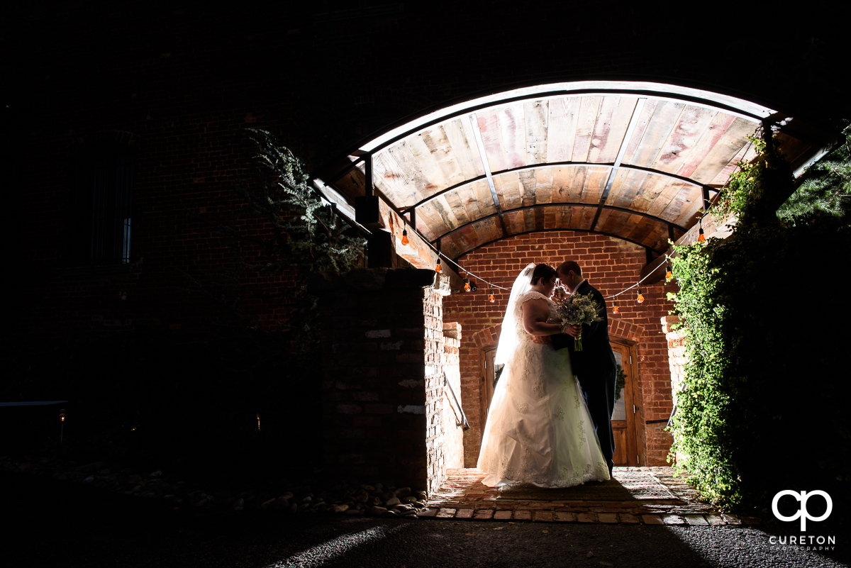 Creative photo of a bride and groom at The Old Cigar Warehouse.