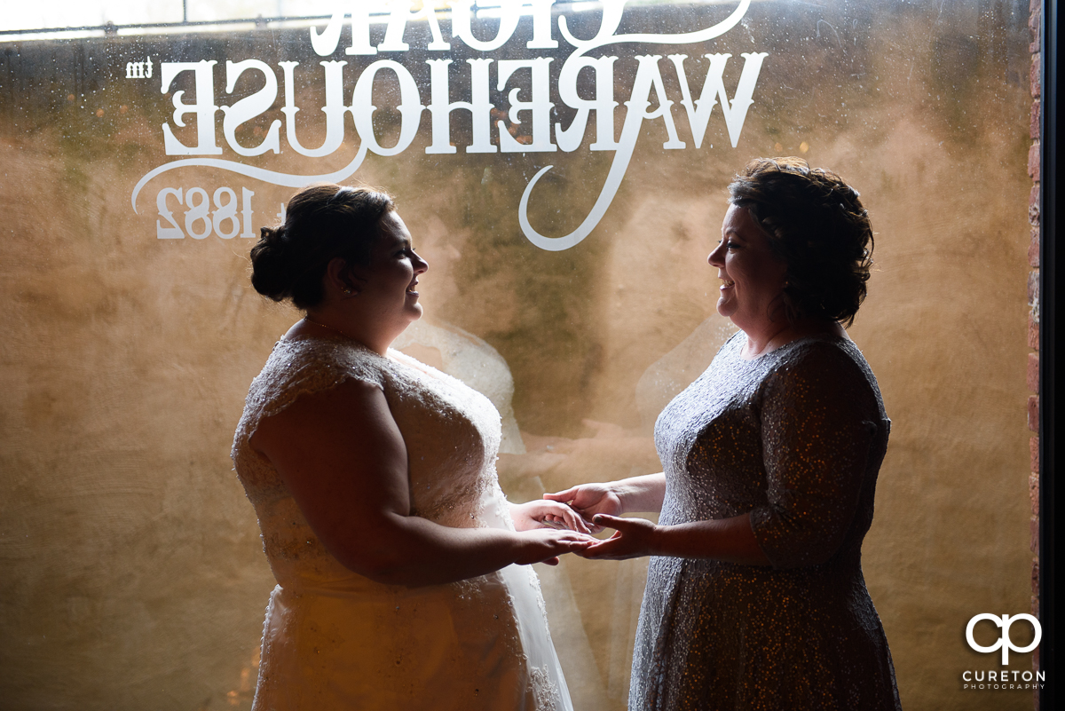 Bride and her mother having a quite moment before the wedding ceremony at The Old Cigar Warehouse.