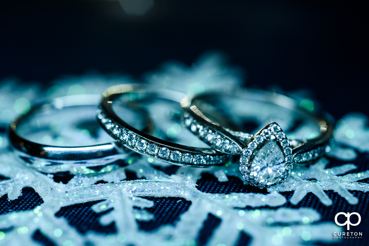 Wedding rings on snowflakes.