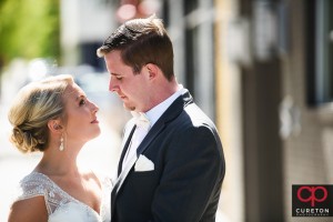 Bride and groom sharing a first look on the streets of downtown Greenville,SC.